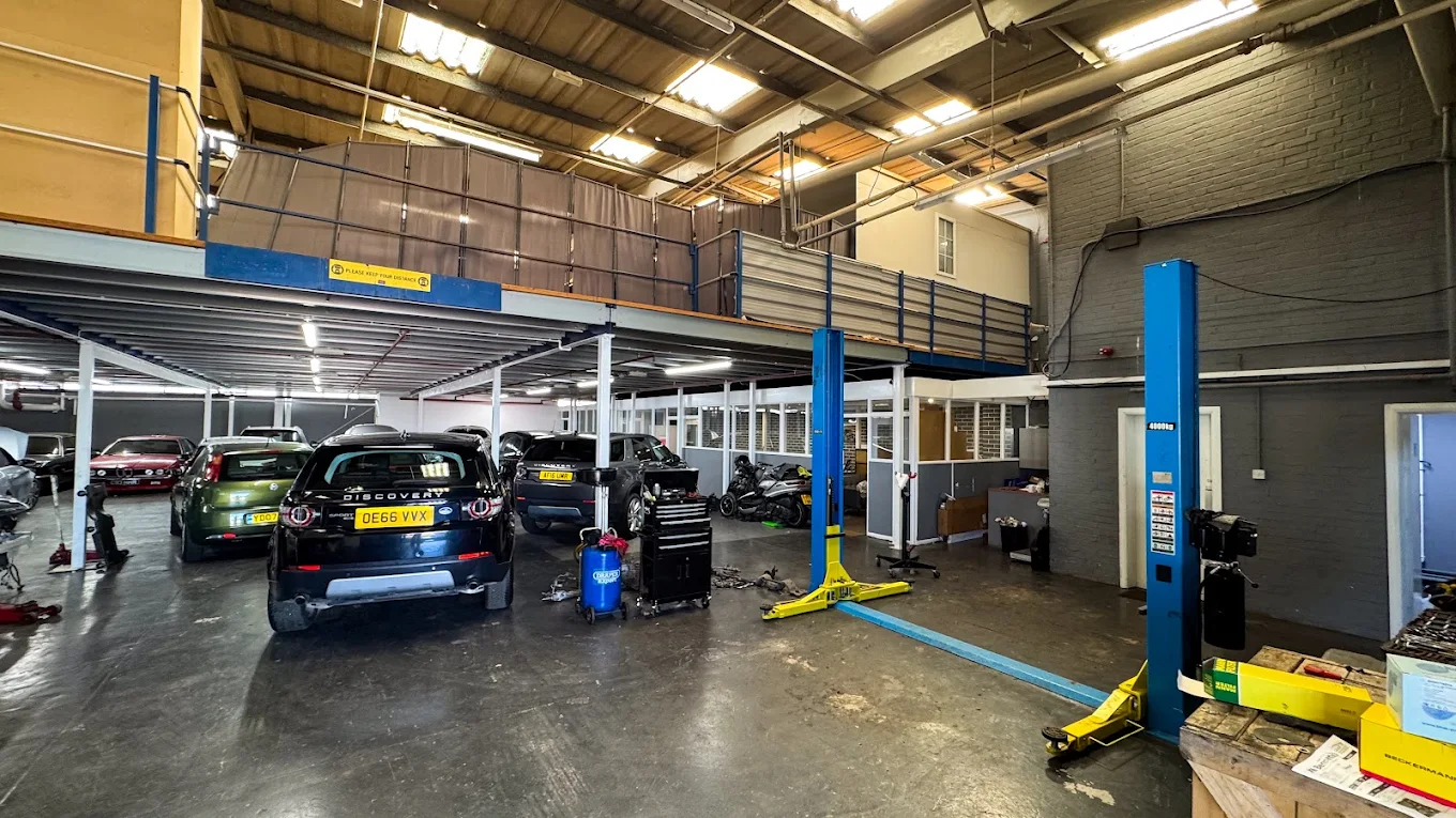 Inside the Prime Automotive workshop — cars on lifts, fully equipped Essex garage
